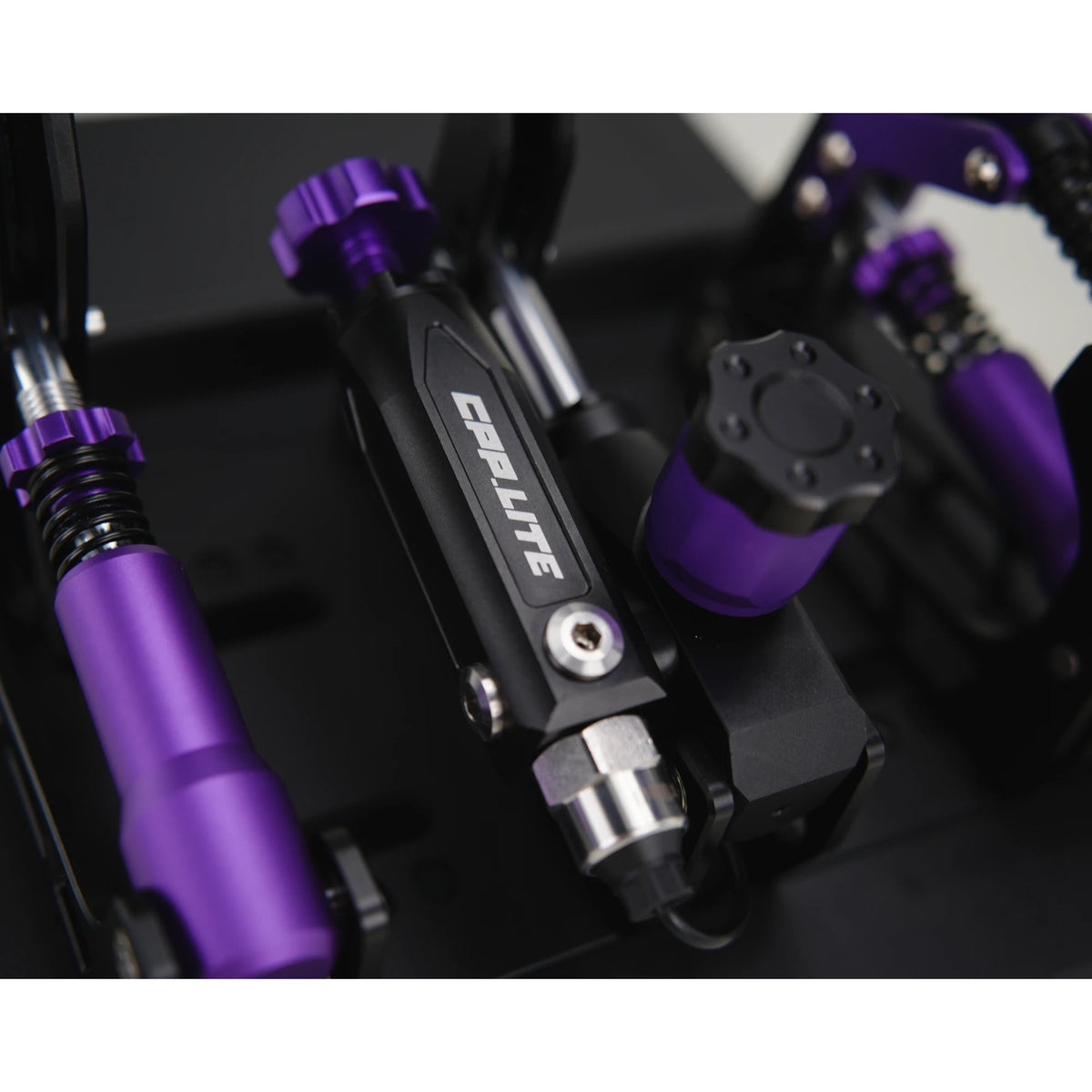 Conspit CPP Lite hydraulic 3 pedal set, close-up on brake cylinder — CPP.LITE-branded hydraulic unit detail